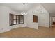 Bright dining room features large bay windows with wood shutters and tile flooring at 509 W Boxelder Pl, Chandler, AZ 85225