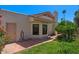 Charming home exterior with well-maintained brick walkway, lush landscaping, and tiled roof at 509 W Boxelder Pl, Chandler, AZ 85225