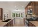 Modern kitchen featuring granite countertops, stainless appliances and a view of the breakfast nook at 509 W Boxelder Pl, Chandler, AZ 85225