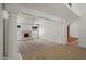Open living space with carpet, fireplace, and columns for an open, airy feel at 509 W Boxelder Pl, Chandler, AZ 85225