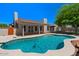 Backyard featuring sparkling pool, covered patio, and lush landscaping at 509 W Boxelder Pl, Chandler, AZ 85225
