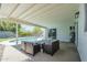Covered patio with outdoor seating overlooking the pool and yard at 520 N 23Rd St, Mesa, AZ 85213