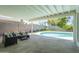 Covered patio with outdoor seating, and a view of the pool and landscaped yard at 520 N 23Rd St, Mesa, AZ 85213