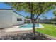 Relaxing backyard with a refreshing pool, a covered patio, and mature trees at 520 N 23Rd St, Mesa, AZ 85213