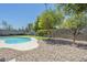 Lush backyard featuring a sparkling pool and rock landscaping at 520 N 23Rd St, Mesa, AZ 85213