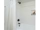 All-white bath and shower combo with shower curtain and a built-in soap niche at 520 N 23Rd St, Mesa, AZ 85213