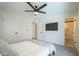 This bedroom features neutral walls, an overhead fan, a carpeted floor, and an ensuite bathroom at 520 N 23Rd St, Mesa, AZ 85213