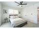 A bright bedroom featuring a cozy queen-sized bed, neutral tones, carpet, and bright light at 520 N 23Rd St, Mesa, AZ 85213