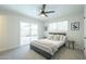 Light-filled bedroom with ceiling fan, soft carpet, and access to the backyard pool at 520 N 23Rd St, Mesa, AZ 85213