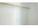 Bright white closet with a wooden hanging rod at 520 N 23Rd St, Mesa, AZ 85213