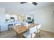 Bright dining room featuring a modern table and chairs adjacent to a renovated kitchen and open living space at 520 N 23Rd St, Mesa, AZ 85213