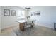 Well-lit dining room with modern table and chairs, neutral tones, and attractive light fixture at 520 N 23Rd St, Mesa, AZ 85213