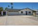 Charming single-story home with desert landscaping, a spacious driveway, and a welcoming entrance at 520 N 23Rd St, Mesa, AZ 85213