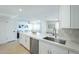 The kitchen bar area overlooks the open-concept living room with lots of natural light at 520 N 23Rd St, Mesa, AZ 85213