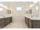Primary bathroom features dual vanities, ample counter space, and well-lit mirrors at 5533 N 193Rd Ave, Litchfield Park, AZ 85340