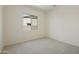 Bedroom shows neutral carpet, white walls, and window at 5533 N 193Rd Ave, Litchfield Park, AZ 85340