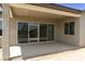 Covered patio with sliding glass doors, providing seamless indoor-outdoor living space at 5533 N 193Rd Ave, Litchfield Park, AZ 85340