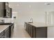 Stylish kitchen featuring stainless steel appliances and a center island at 5533 N 193Rd Ave, Litchfield Park, AZ 85340