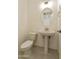 Modern powder room with a pedestal sink, and updated fixtures at 5533 N 193Rd Ave, Litchfield Park, AZ 85340