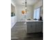 Open-concept kitchen and dining area with sleek countertops and modern decor at 6421 S 23Rd Dr, Phoenix, AZ 85041