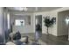 Open living space featuring modern decor, hardwood floors, and view into kitchen creates inviting ambiance at 6421 S 23Rd Dr, Phoenix, AZ 85041