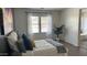 Cozy bedroom with natural light, modern decor, and a calming atmosphere, perfect for relaxation at 6421 S 23Rd Dr, Phoenix, AZ 85041