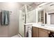 Cozy bathroom features a glass shower and a light wood vanity to create a soothing and functional space at 6657 W Aurora Dr, Glendale, AZ 85308