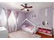 Charming bedroom featuring a playful unicorn theme, plush rug, and a comfortable, inviting ambiance at 6657 W Aurora Dr, Glendale, AZ 85308
