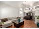 Spacious living room featuring high ceilings, a modern sofa, bar, and large windows offering natural light at 6657 W Aurora Dr, Glendale, AZ 85308