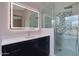 Bathroom with marble countertops, glass shower, and decorative tile accents at 6672 E Horned Owl Trl, Scottsdale, AZ 85266