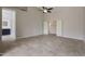 Spacious primary bedroom with tile flooring, ensuite bathroom, and walk-in closet at 6672 E Horned Owl Trl, Scottsdale, AZ 85266