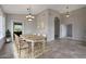 Elegant dining room with a wooden table, seating for eight, and stylish chandelier at 6672 E Horned Owl Trl, Scottsdale, AZ 85266