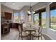 Dining nook featuring dark wood cabinets, marble countertops, with breakfast table set at 6672 E Horned Owl Trl, Scottsdale, AZ 85266