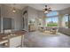 Comfortable living area with neutral tones, elegant furnishings, and large windows with shutters at 6672 E Horned Owl Trl, Scottsdale, AZ 85266