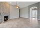 Open living room with stone fireplace and tile flooring, welcoming and spacious at 6672 E Horned Owl Trl, Scottsdale, AZ 85266