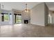 Open living room with backyard access and fireplace, perfect for relaxing and entertaining at 6672 E Horned Owl Trl, Scottsdale, AZ 85266