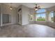 Bright and airy living room with tile floors, large windows, and shutter blinds at 6672 E Horned Owl Trl, Scottsdale, AZ 85266