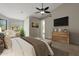 Bright main bedroom with large window, vaulted ceiling, and ceiling fan at 6672 E Horned Owl Trl, Scottsdale, AZ 85266