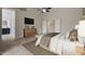 Spacious main bedroom with neutral colors, tile floors, and mounted television at 6672 E Horned Owl Trl, Scottsdale, AZ 85266
