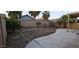 Spacious backyard with a paved patio area, fruit trees, and potential for landscaping at 6722 W Shannon St, Chandler, AZ 85226