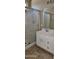 Bathroom featuring vanity with double sinks and glass door walk-in shower at 6722 W Shannon St, Chandler, AZ 85226