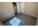 Bedroom featuring wood-look floors, neutral colored walls, closet access and good natural light at 6722 W Shannon St, Chandler, AZ 85226