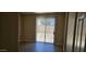 Cozy room with light walls, leading to backyard at 6722 W Shannon St, Chandler, AZ 85226