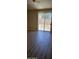 Well-lit bedroom with sliding glass doors and wood-look flooring at 6722 W Shannon St, Chandler, AZ 85226