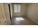 Bedroom with wood-look flooring, neutral paint, and natural light coming through window at 6722 W Shannon St, Chandler, AZ 85226