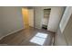 Bedroom featuring wood-look floors, closet with sliding doors, and good natural light at 6722 W Shannon St, Chandler, AZ 85226