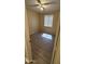 Bedroom with wood-look flooring and neutral colored walls, plus a window allowing natural light at 6722 W Shannon St, Chandler, AZ 85226