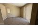 Spacious bedroom with wood-look floors and large window with vertical blinds at 6722 W Shannon St, Chandler, AZ 85226