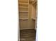 Spacious walk-in closet with built-in shelving and wood-look flooring at 6722 W Shannon St, Chandler, AZ 85226