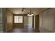Inviting dining area featuring a ceiling fan, modern light fixture, and window at 6722 W Shannon St, Chandler, AZ 85226